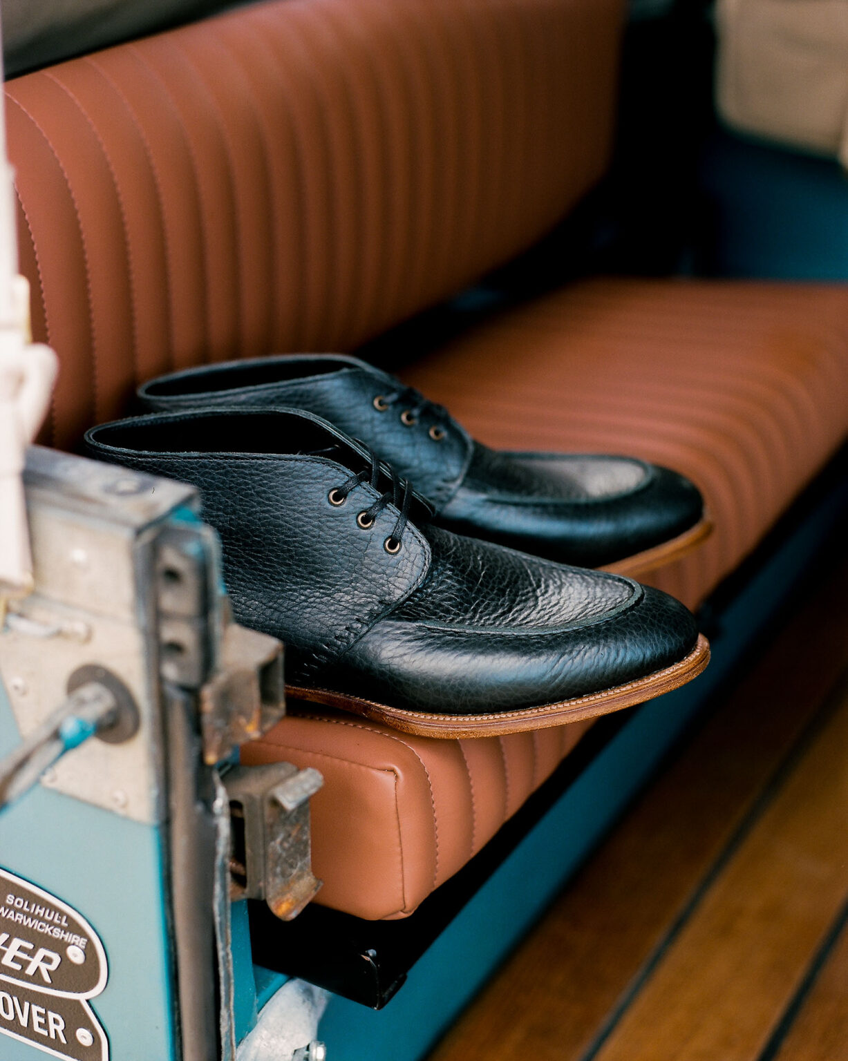 E.Woodford Edgware Ankle Boot in Black Horween Veg Tanned Bison on the rear seats of a vintage Land Rover Defender