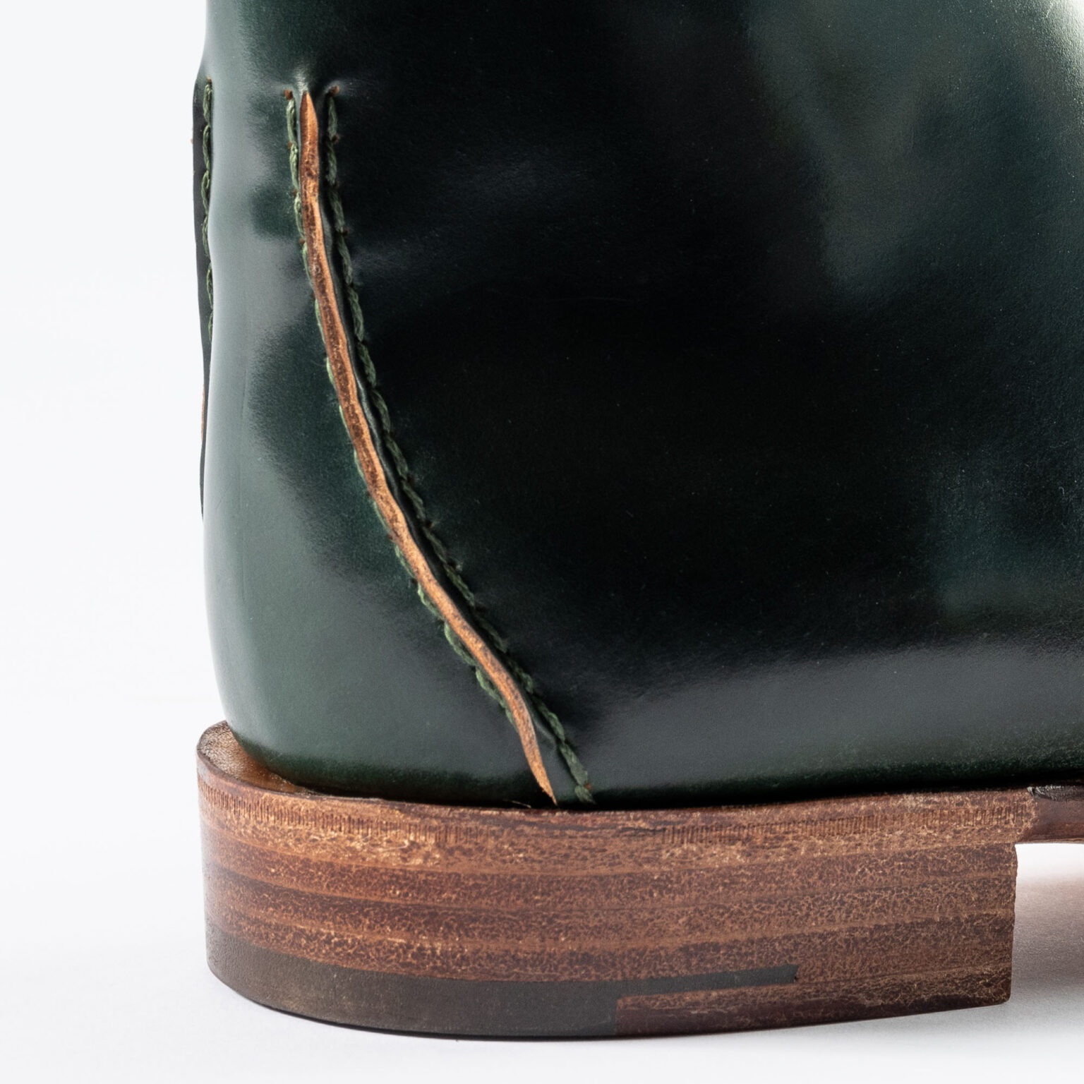 Closeup of raised seams on rear of Edgware Ankle Boot in Green Horween Shell Cordovan