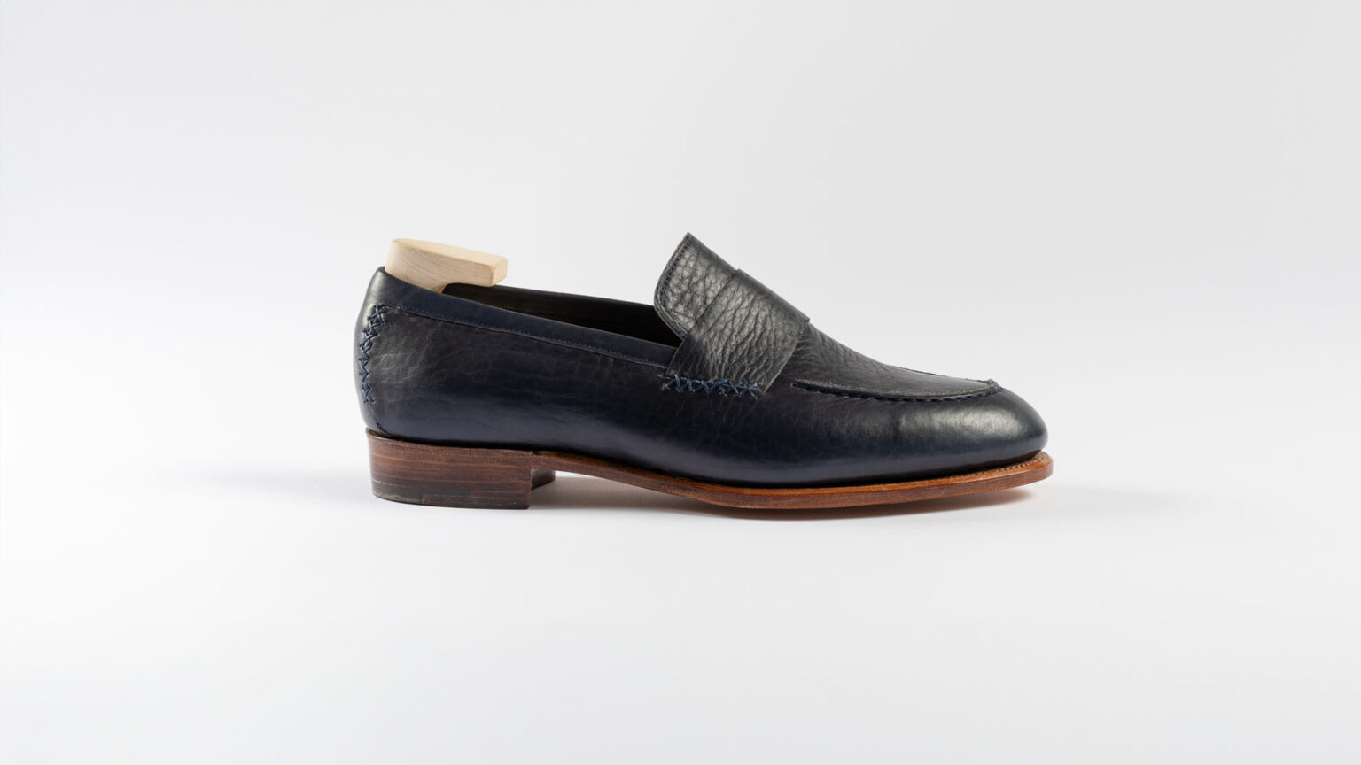 Side view of Fen Baseball Loafer in Navy Horween Veg Tanned Bison