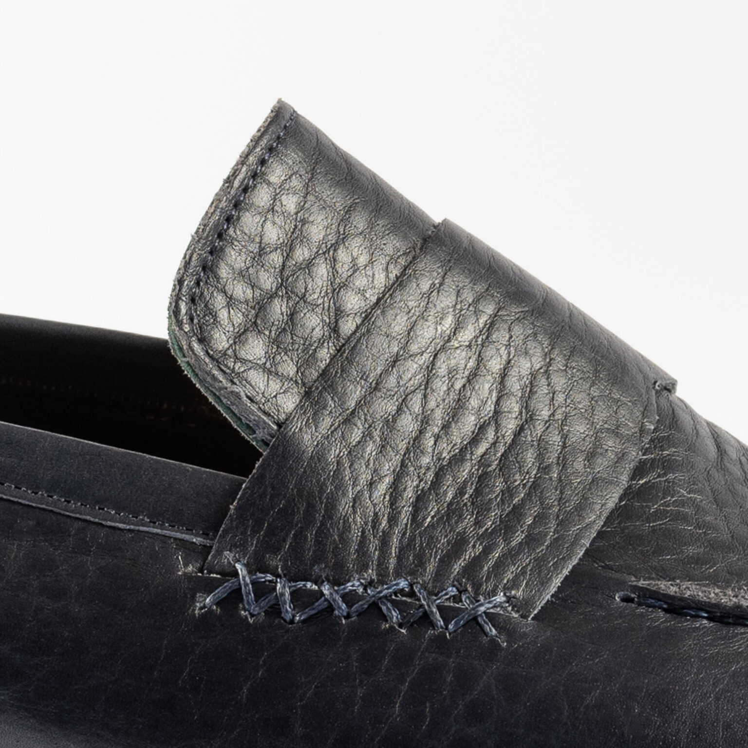 Side view closeup of strap on Fen Baseball Loafer in Navy Horween Veg Tanned Bison