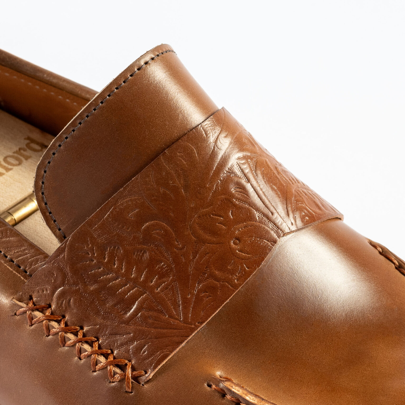 Closeup of stitched strap on Fen Baseball Loafer in Bourbon Floral Horween Shell Cordovan