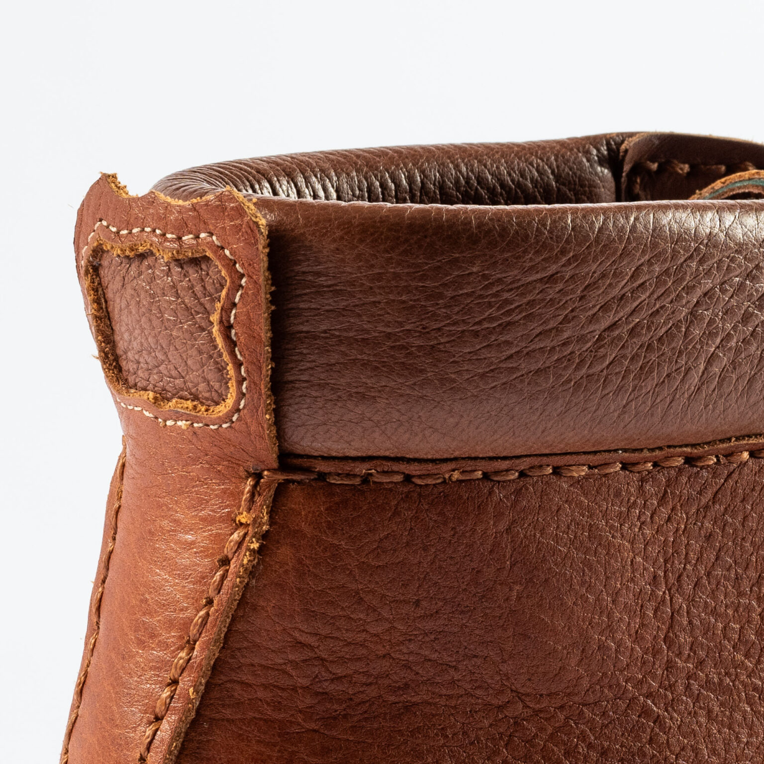 Closeup of shield and backstrip on Foxley Padded Ankle Boot in Tan Horween Veg Tanned Bison