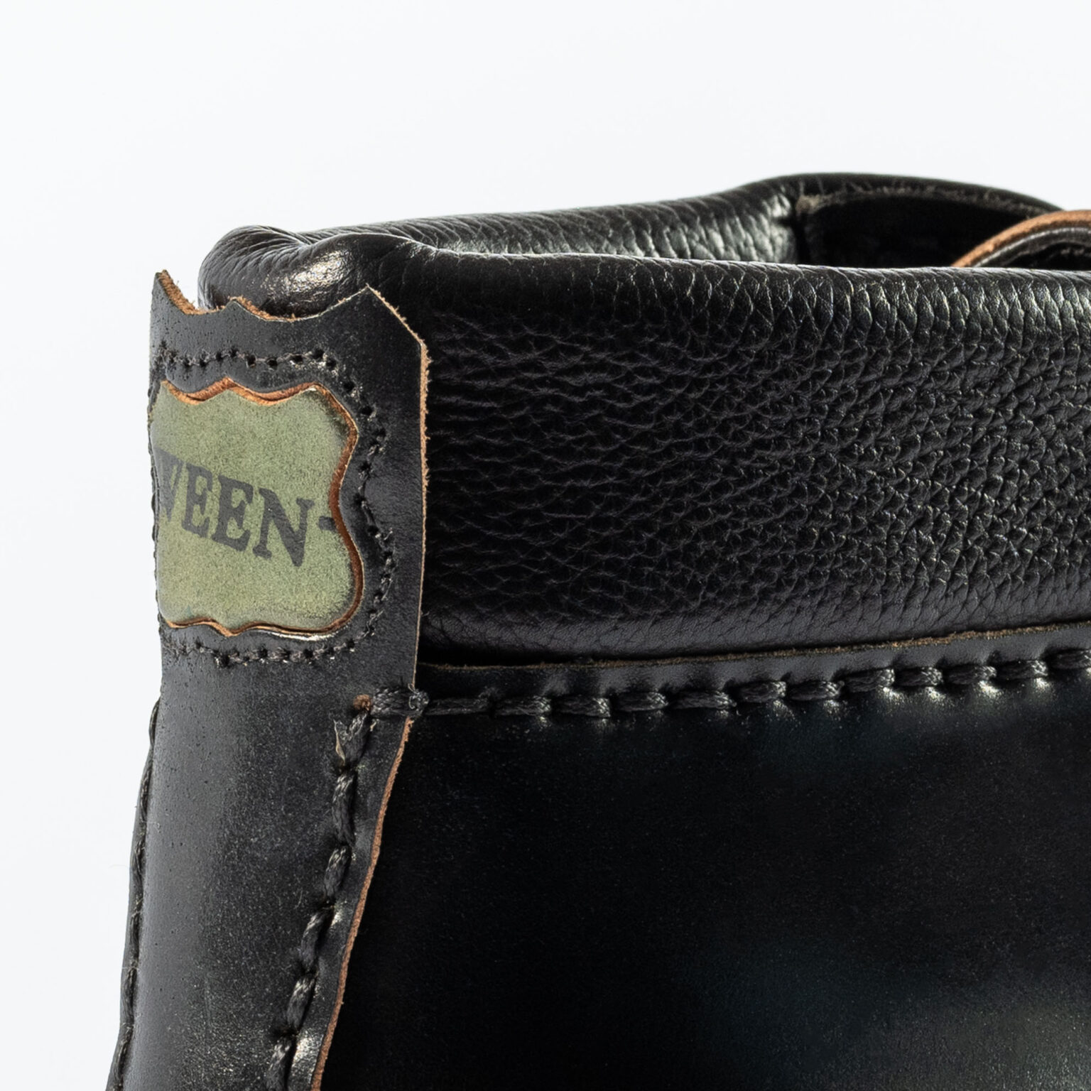 Closeup of shield and backstrip on Foxley Padded Ankle Boot in Black Horween Shell Cordovan