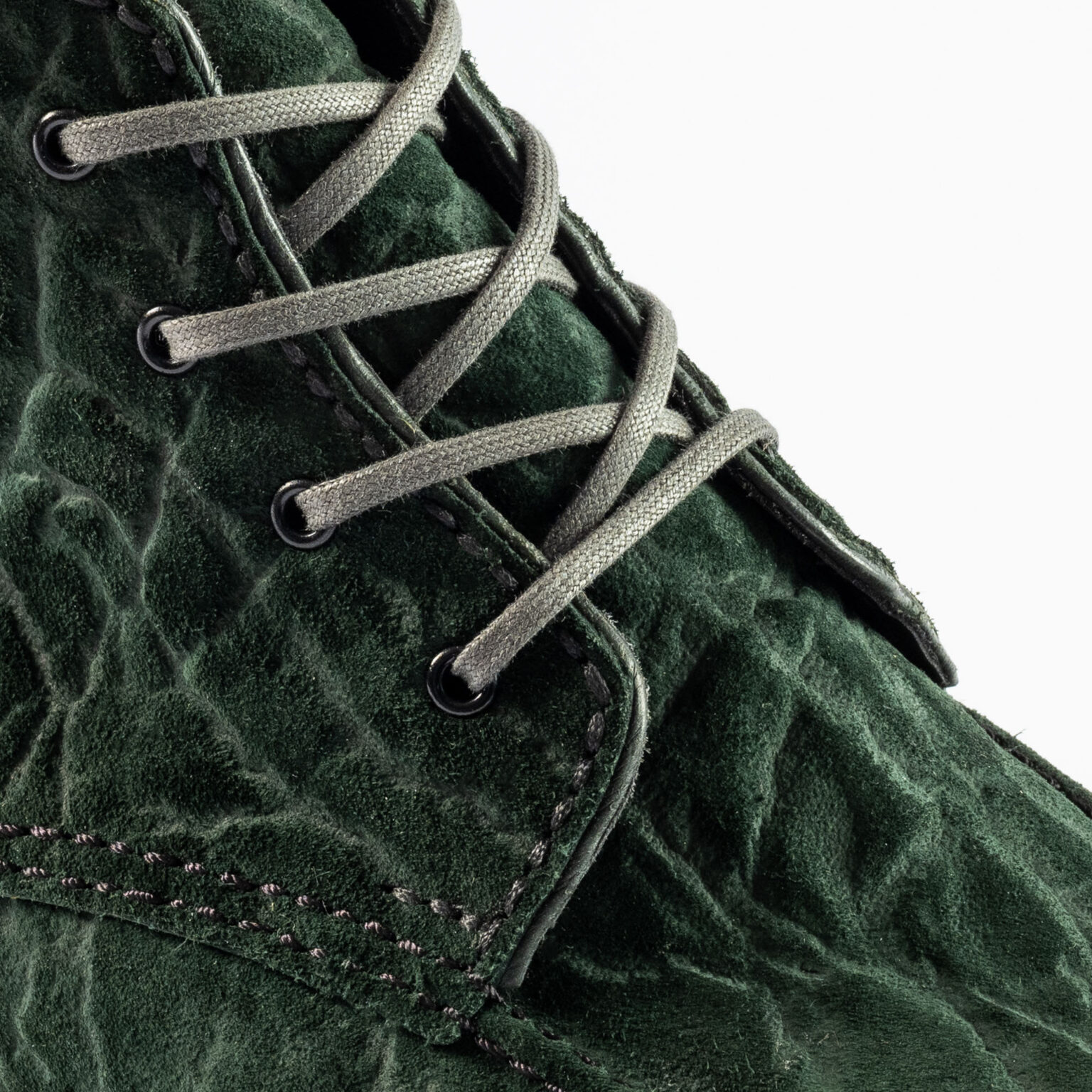 Closeup of tongue and quarters on Foxley Padded Ankle Boot in Racing Green CF Stead Janus Calf with Edwin emboss