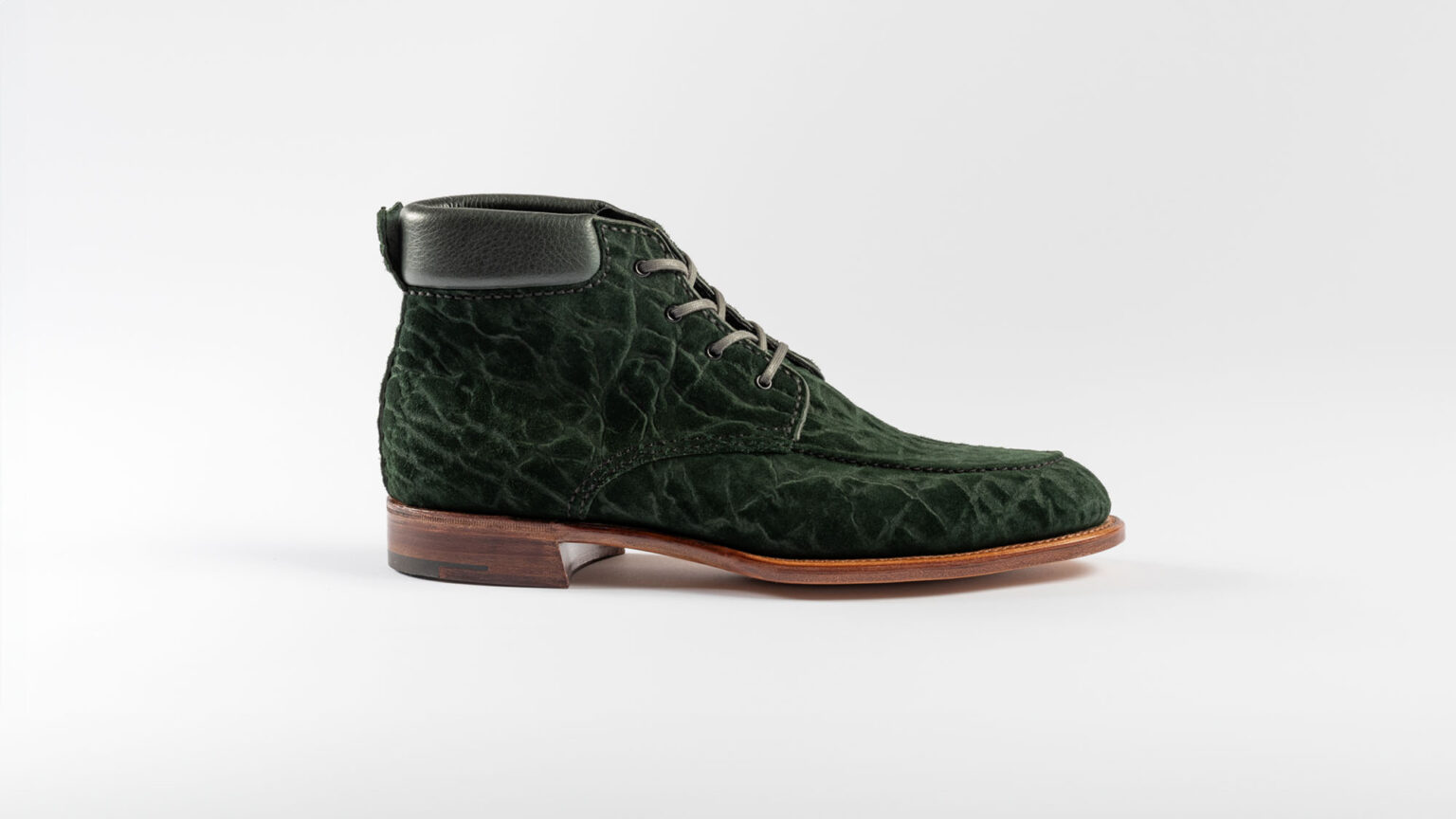 Side view of Foxley Padded Ankle Boot in Racing Green CF Stead Janus Calf with Edwin emboss