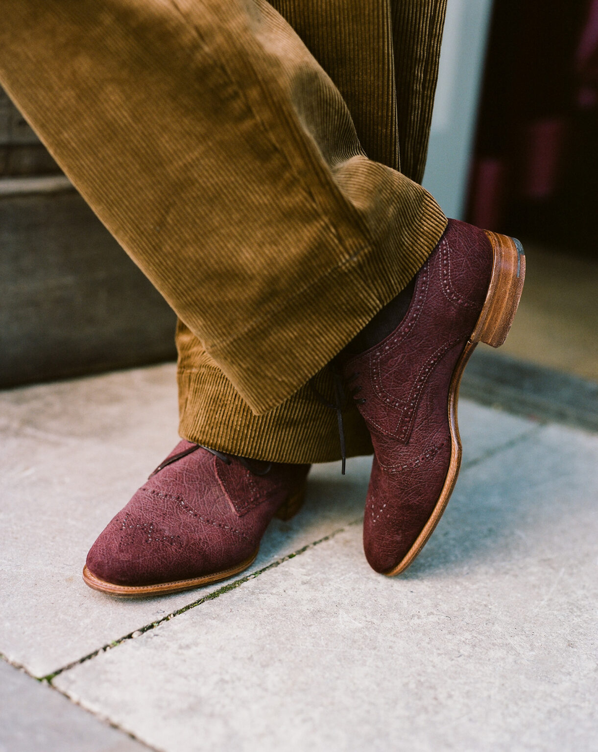 Closeup of a gentleman wearing light brown corduroy trousers and a pair of Redbourne Five Eyelet Oxfords in Dark Tobacco CF Stead Janus Calf with Ernest emboss