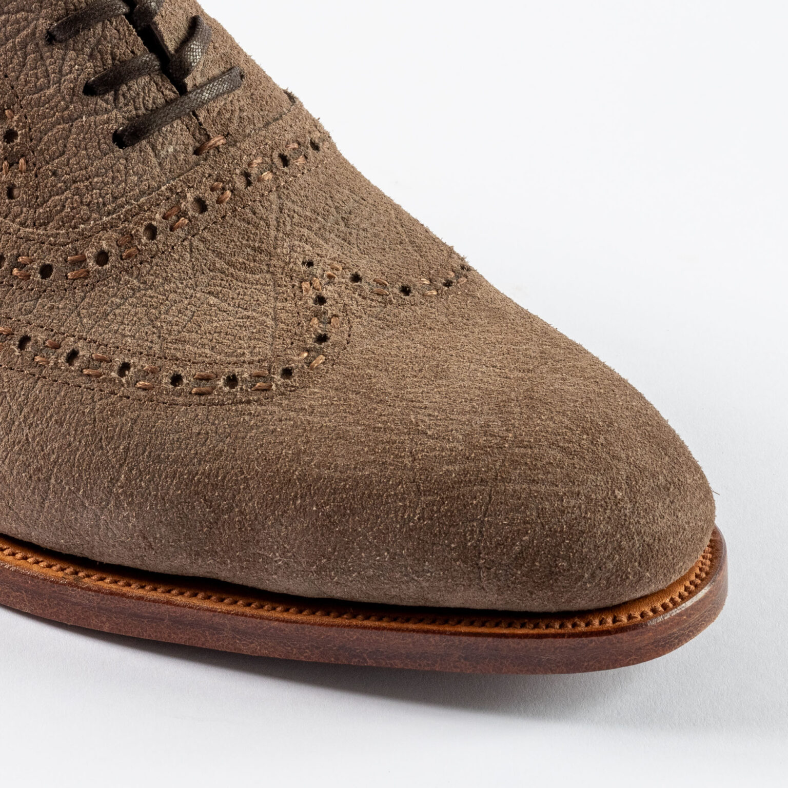 Closeup of toe and vamp of Redbourne Oxford in Fog CF Stead Janus Calf with Ernest emboss