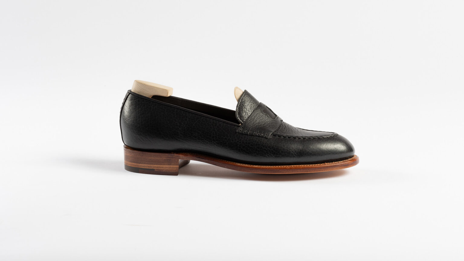 Side view of Watling Penny Loafer in Black Horween Veg Tan Bison