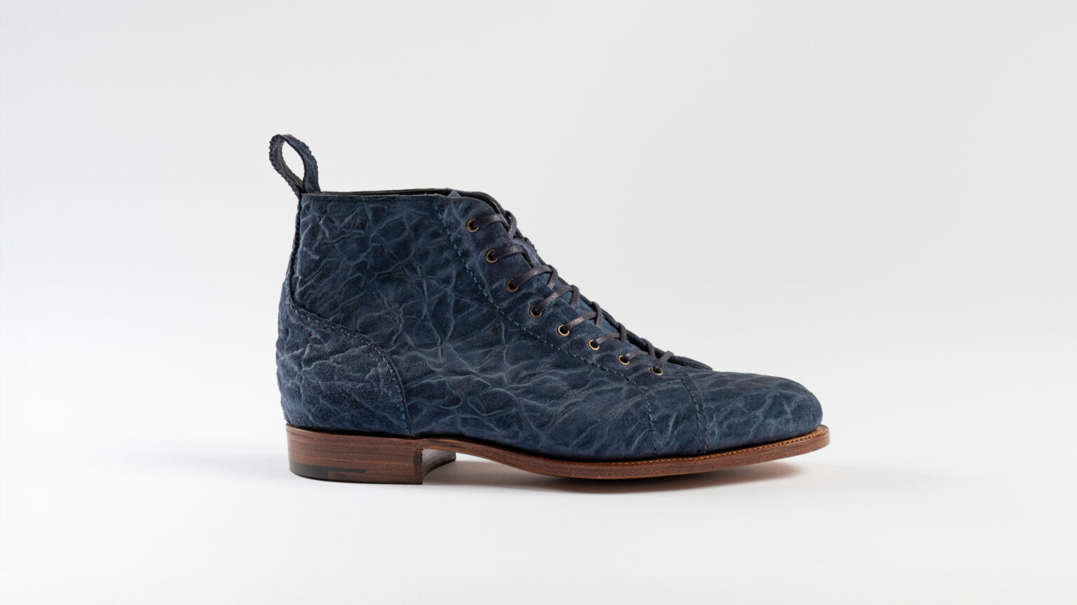 Side view of Woburn Monkey Boots in Navy CF Stead Janus Calf with Edwin emboss